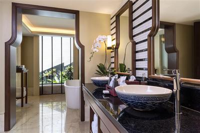 Twin sinks in a guest room bathroom