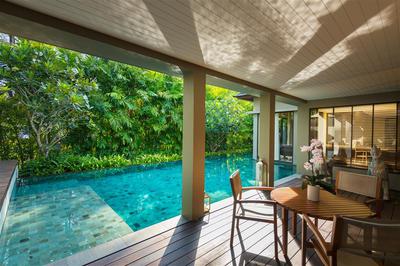 Dinning table by the pool of the Two Bedroom Villa