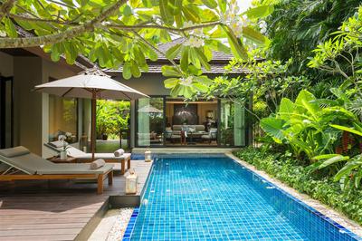 Sun loungers on the deck next to a private pool