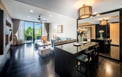 Living room, dining table and kitchen