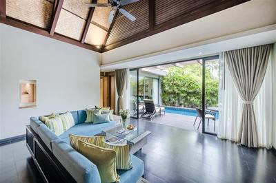 Living room area with view of the private pool