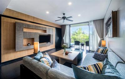 Living room area with garden and balcony view