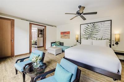 Master bedroom with open door to bathroom