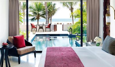 One King Bedroom with view of the pool and beach