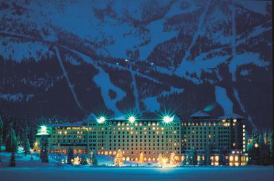 Hotel At Night With Ski Hill In Background