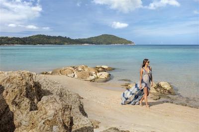 A woman walking on the beach