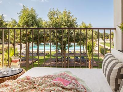 Deluxe Pool View Room with Balcony