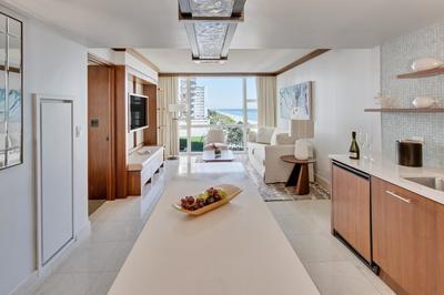 One King & Two Queen Beds with Balcony & Partial Ocean View