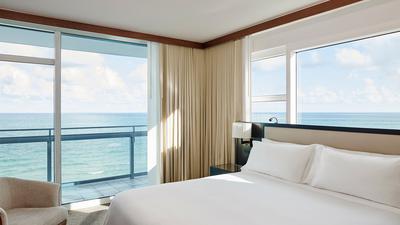 One King & Two Queen Beds with Balcony & Oceanfront View