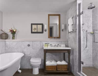 Spacious Suite bathroom with luxurious rolltop bat