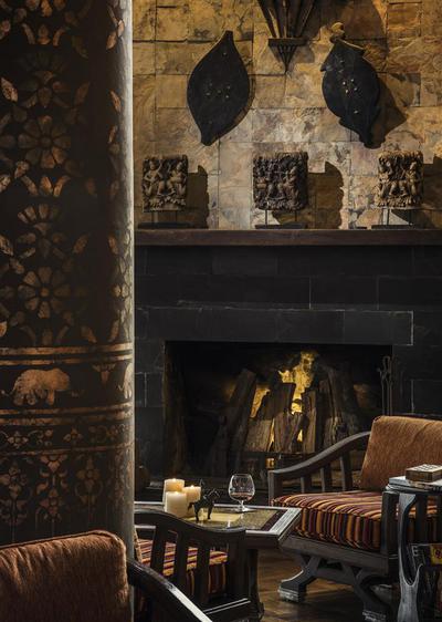 Armchair next to the fireplace at Elephant Bar