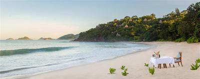 Romantic private dinner setup on beach